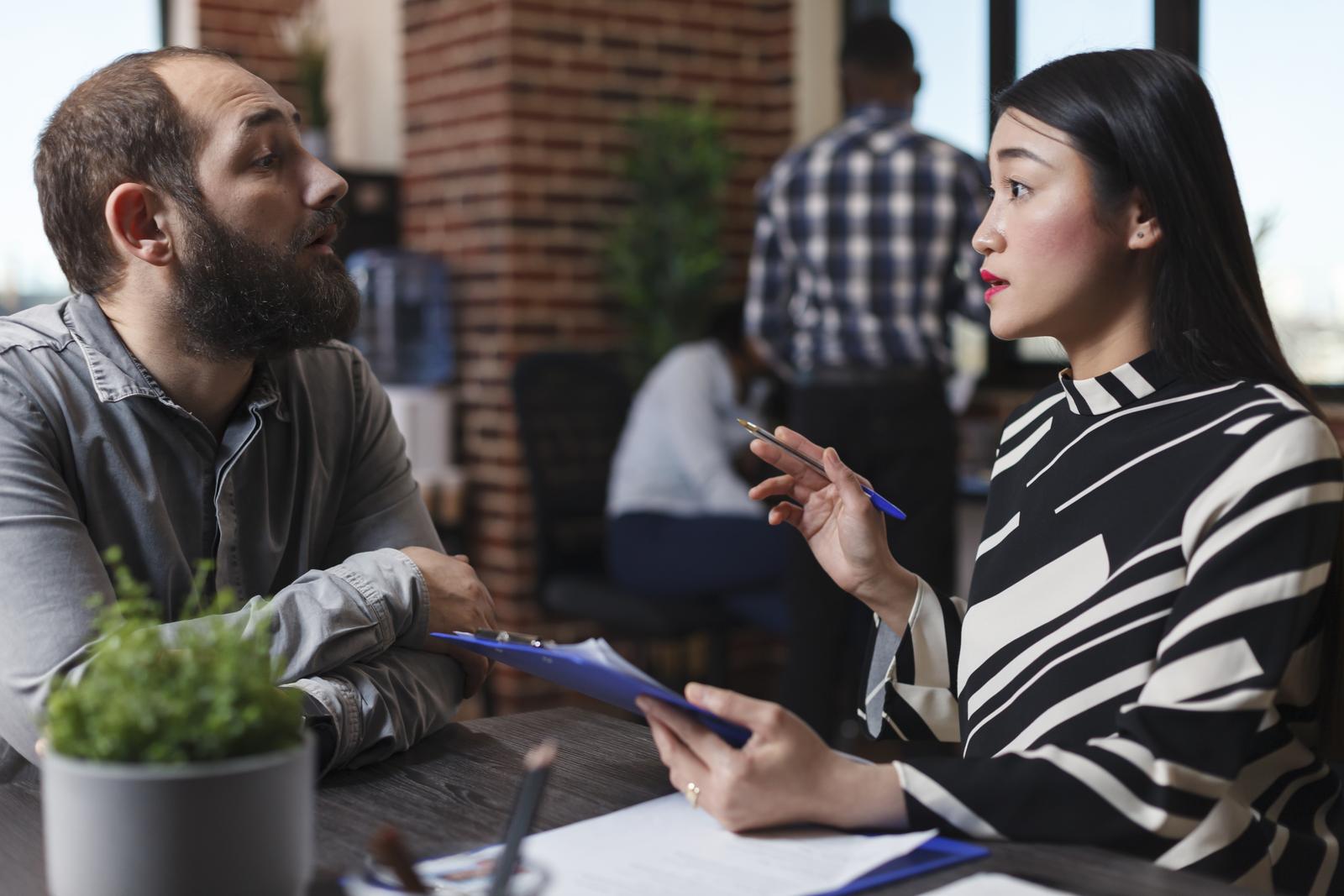 Executive manager interviewing worker applicant recruiting for hr job discussing business offer in startup office. Businesswoman hiring candidate after checking cv resume. Recruitment concept
